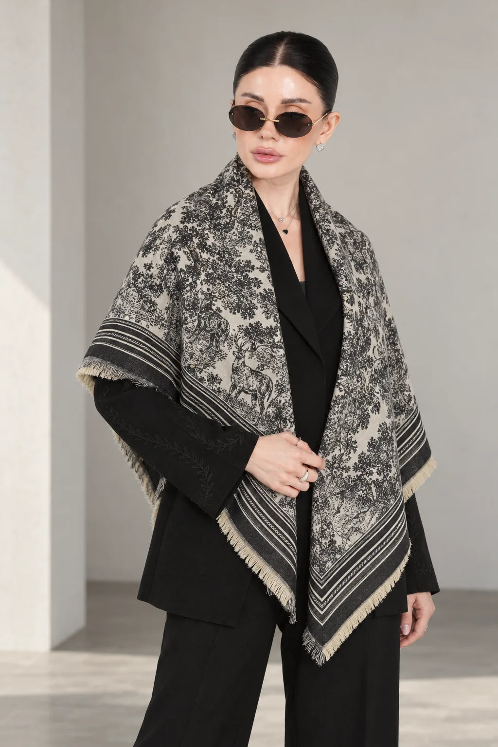 BLACK cashmere animal print square shawl folded into a triangle — standing