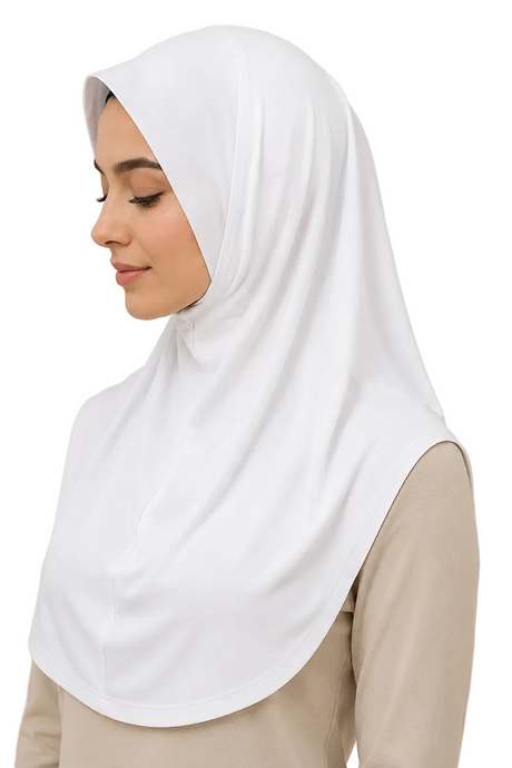 Woman wearing a white hijab against a beige background